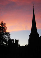 The Deanery Tower and St Mary's Church in Hadleigh silhouetted against the evening sky